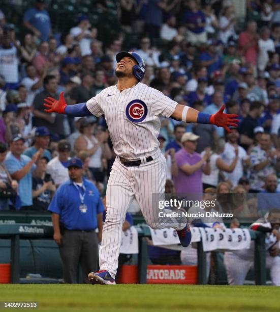 Willson Contreras of the Chicago Cubs celebrates his two-run home run in the third inning against the San Diego Padres at Wrigley Field on June 14,...