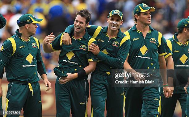 Daniel Christian of Australia celebrates with team mate Michael Hussey after taking five wickets including a hat trick during the One Day...