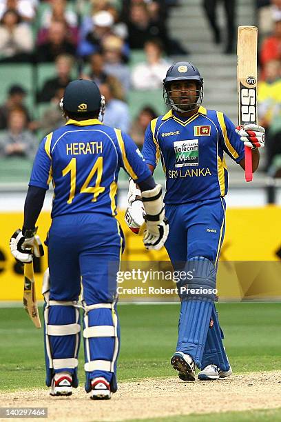 Lahiru Thirimanne of Sri Lanka celebrates his half century during the One Day International match between Australia and Sri Lanka at Melbourne...