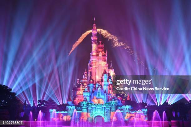 Fireworks and lights illuminate the Sleeping Beauty Castle during a media premiere show ahead of the "Momentous" nighttime fireworks and projection...