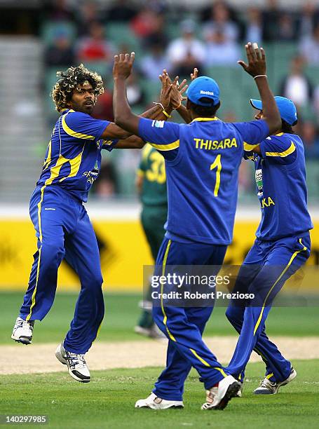 Lasith Malinga of Sri Lanka celebrates taking the wicket of Peter Forrest of Australia during the One Day International match between Australia and...