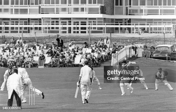 Spectators look on from their deck chairs as Mansoor Ali Khan Pataudi, Nawab of Pataudi , right-handed batsman for Sussex County Cricket Club plays a...