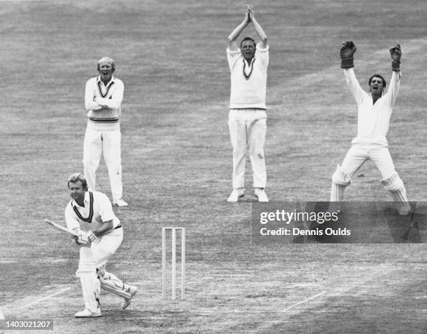 Wicketkeeper Roger Tolchard and slip fielders Ken Higgs , Jack Birkenshaw of Leicestershire County Cricket Club appeal for an LBW on batter Dudley...