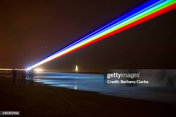 International artist Yvette Mattern shows her stunning laser rainbow projection, Global Rainbow, on March 1, 2012 in Whitley Bay, England. The light...