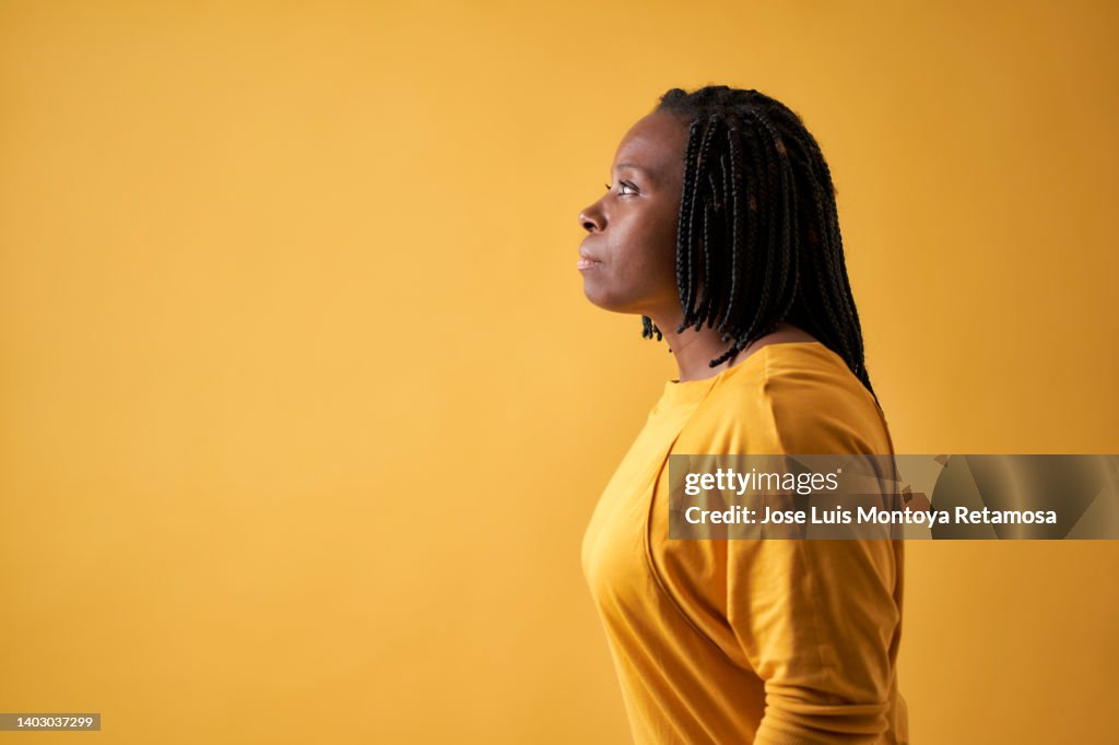 Portrait of a serious black woman seen from the side