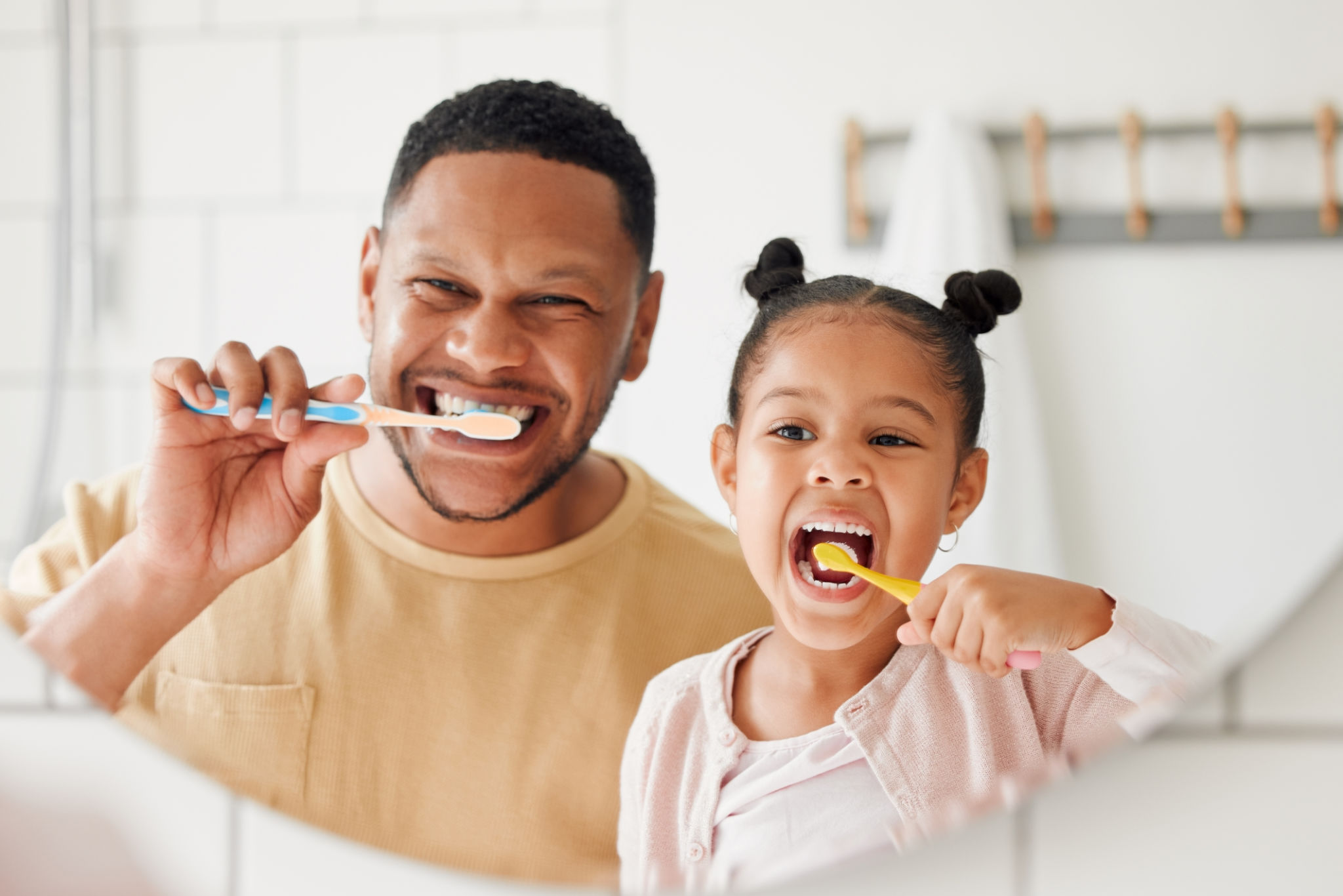 smiling person brushing teeth