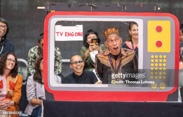 Lumbung artist Agus Nur Amal PMTOH performs at the opening press conference during the first press day at the documenta 15 modern art fair on June...