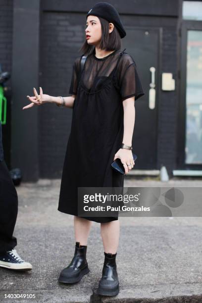 Guest is seen wearing Black Organza Dress with a Black Beret. At The University of Westminster MA Menswear during London Fashion Week on June 12,...