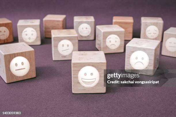 happy and depressed and sad symbol on wood blocks, customer experience concept - customer experience stock pictures, royalty-free photos & images