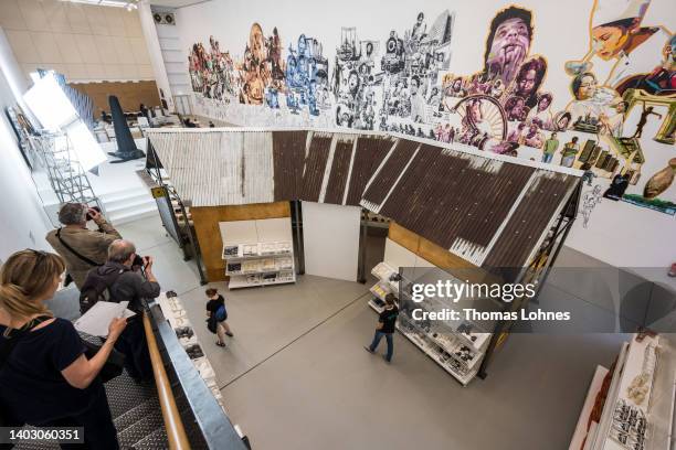 The installation 'Rasad' stands in the documenta hall with the painting 'Chayachobi' on the wall pictured at the first press day of the documenta 15...