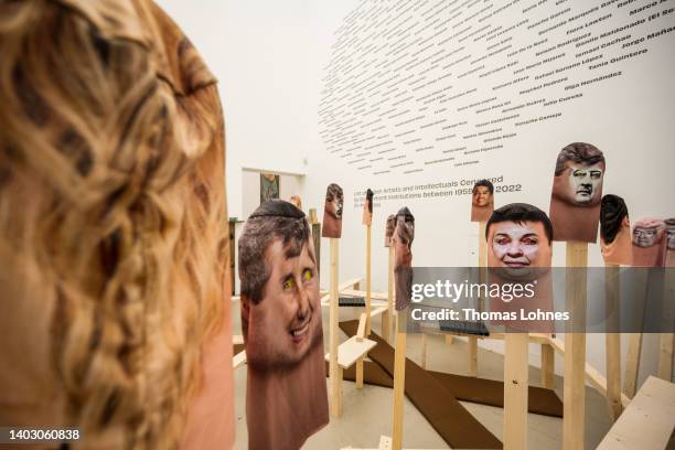 Prints of faces are seen, part of the art work of the 'Instituto de Artivismo hannah Arendt in the documenta hall during the first press day at the...