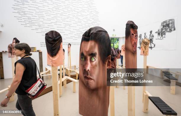 Prints of faces are seen, part of the art work of the 'Instituto de Artivismo hannah Arendt in the documenta hall during the first press day at the...