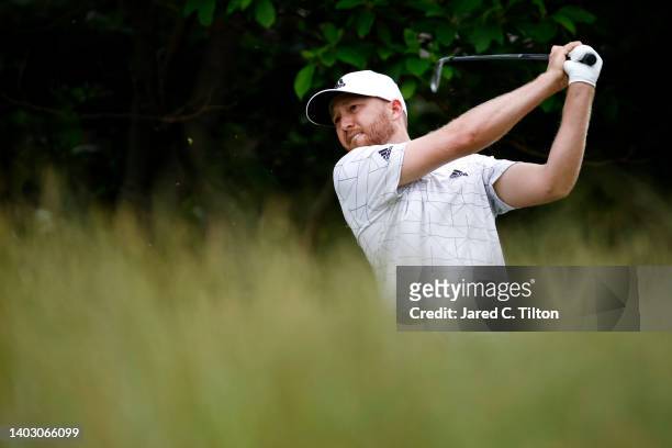 Daniel Berger of the United States plays his shot from the seventh tee during a practice round prior to the US Open at The Country Club on June 15,...