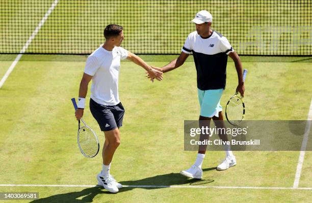 Rajeev Ram of The United States celebrates a point with partner Joe Salisbury of Great Britain against Jamie Murray of Great Britain and Bruno Soares...