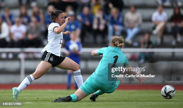 Estrella Merino Gonzales of Germany is challenged by Goalkeeper Maya Dybro of Denmark during the International Friendly match between Germany Women...