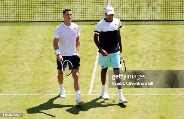 Rajeev Ram of The United States interacts with partner Joe Salisbury of Great Britain against Jamie Murray of Great Britain and Bruno Soares of...