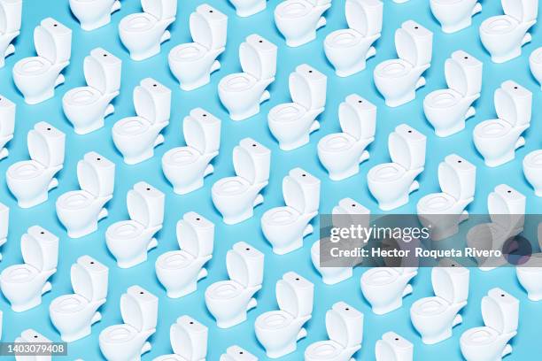 white toilet bowl on blue background, 3d render - toilet bowl stock pictures, royalty-free photos & images