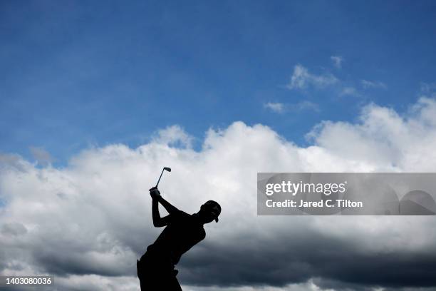 Rikuya Hoshino of Japan plays his shot from the sixth tee during a practice round prior to the 122nd U.S. Open Championship at The Country Club on...