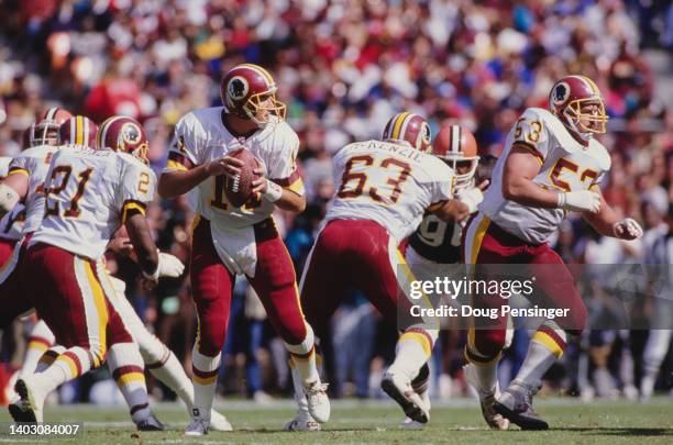 Mark Rypien, Quarterback for the Washington Redskins steps out of the pocket during the National Football Conference West Division game against the...