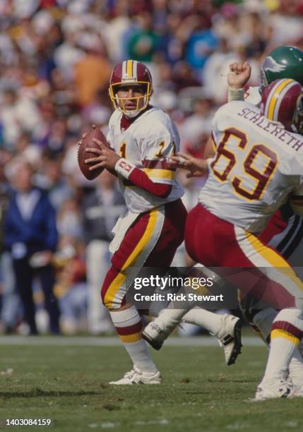 Mark Rypien, Quarterback for the Washington Redskins prepares to throw the football upfield the during the National Football Conference East Division...