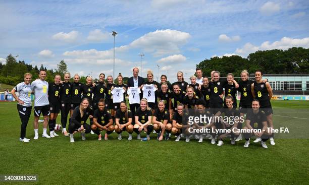 Prince William, The Duke of Cambridge poses for a picture with the England Women's team during a training session at St George's Park on June 15,...