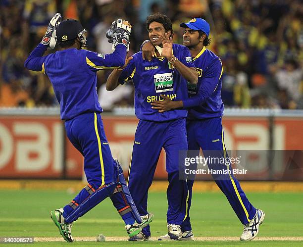 Sachithra Senanayake of Sri Lanka celebrates with team mates after taking the wicket of Daniel Christian of Australia during the One Day...