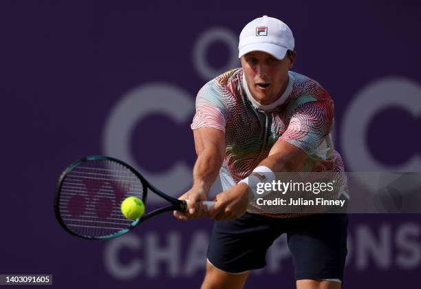 Ken Skupski of Great Britain plays a backhand with partner Jonny O'Mara of Great Britain against Mate Pavic of Croatia and Nikola Mektic of Croatia...