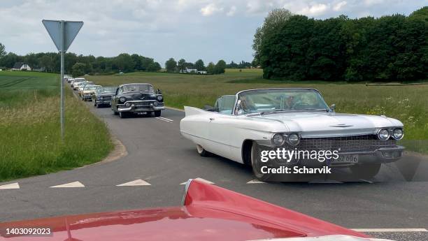 classic veteran cadillacs cruising danish roads - cadillac eldorado stock pictures, royalty-free photos & images