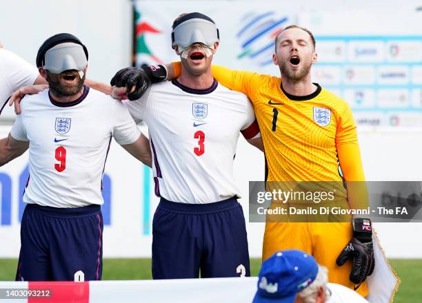 Roy Turnham, Owen Bainbridge and Dylan Malpas of England stand during the national anthems prior to the 2022 IBSA Blind Football Men's European...