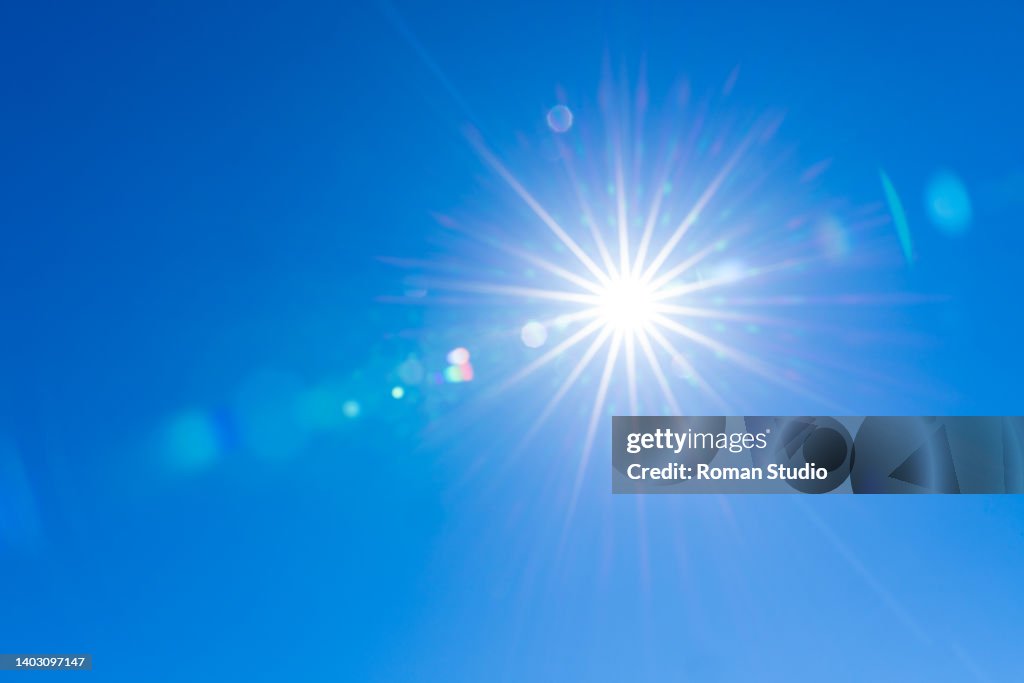 Sun In Blue Sunburst With Lens Flare Clear Sky Sun Blue Sky High-Res Stock Photo ...
