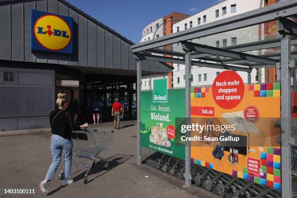 Shopper returns a shopping cart after buying groceries at a Lidl discount supermarket on June 15, 2022 in Berlin, Germany. Inflation has skyrocketed...