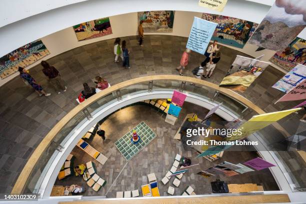 Visitors walk through the rotunda at the Fridericianum during the first preview day at the documenta 15 modern art fair on June 15, 2022 in Kassel,...
