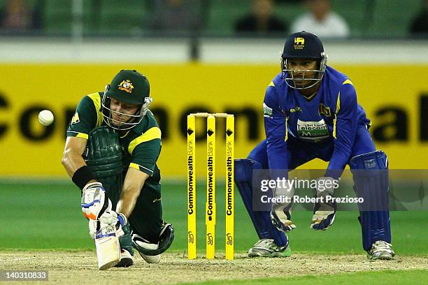 Michael Hussey of Australia plays a shot during the One Day International match between Australia and Sri Lanka at Melbourne Cricket Ground on March...