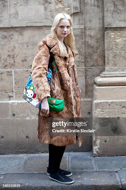 Chrystal Copland, model wearing a Marc by Marc Jacobs Jacket bag, Marc Jacobs dress, vintage jacket and H and M shoes street style at Paris fashion...