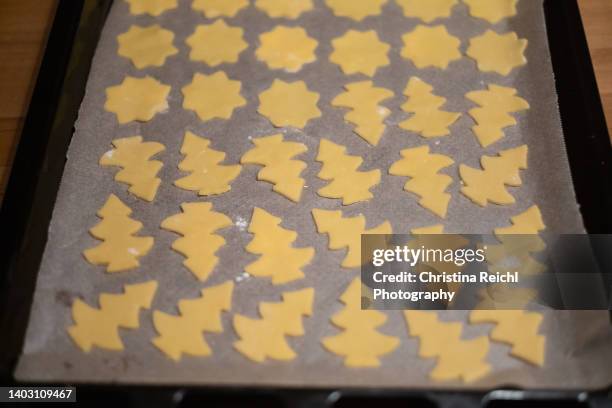 christmas cookies on baking tray - rolling pin stock pictures, royalty-free photos & images