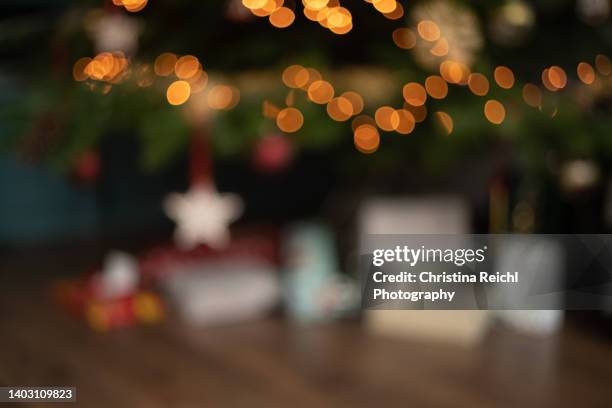 many christmas presents under christmas tree - present luminoso imagens e fotografias de stock