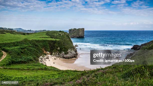 scenic view of sea against sky,llanes,spain - llanes stock-fotos und bilder