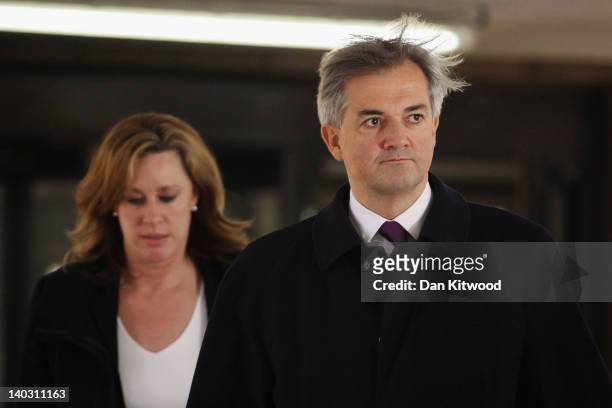 Former Cabinet Minister Chris Huhne leaves Southwark Crown Court after a pre-trial hearing on March 2, 2012 in London, England. Mr Huhne and his...