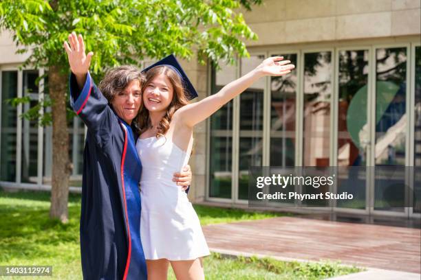 mother congratulates for her daughter on graduation day - mother congratulating stock pictures, royalty-free photos & images