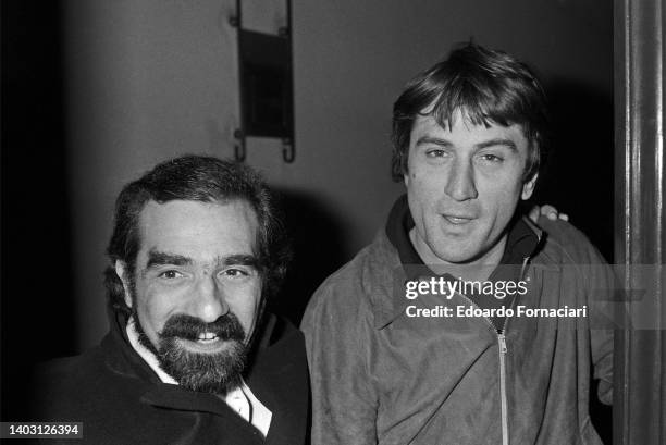 Martin Scorsese, film director, with Robert De Niro, actor, opening the door of Isabella Rossellini's house . February 01, 1982.