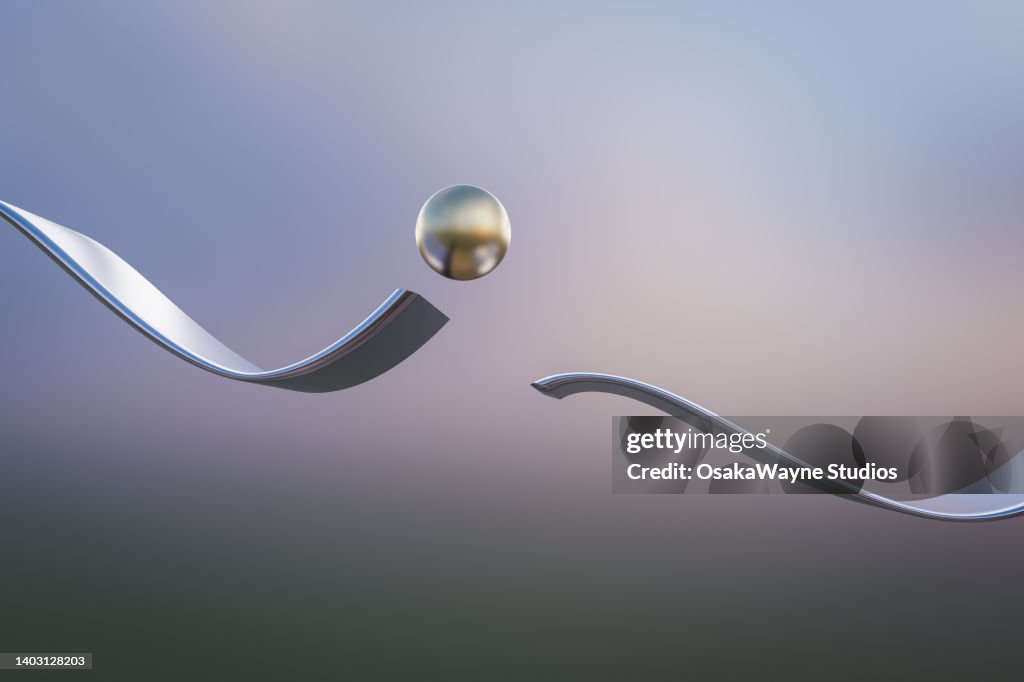 Metal ball jumping over interruption of wavy track