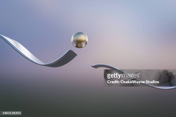metal ball jumping over interruption of wavy track - 3d balls stock pictures, royalty-free photos & images