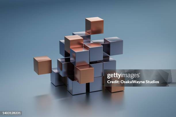 silver and gold colour metal cubes - würfel stock-fotos und bilder