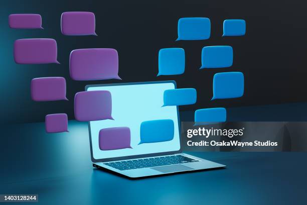 blue and purple rectangular speech bubbles above opened laptop - facebook computer stock pictures, royalty-free photos & images