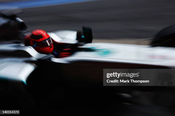 Michael Schumacher of Germany and Mercedes GP exits his team garage during day two of Formula One winter testing at the Circuit de Catalunya on March...