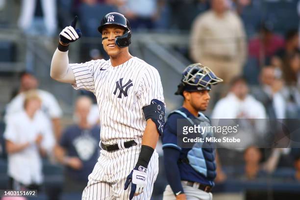 Aaron Judge of the New York Yankees celebrates after hitting a first inning home run against the Tampa Bay Rays at Yankee Stadium on June 15, 2022 in...