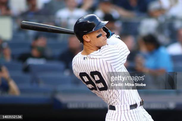 Aaron Judge of the New York Yankees hits a first inning home run against the Tampa Bay Rays at Yankee Stadium on June 15, 2022 in the Bronx borough...