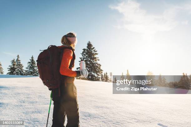 active female ski touring on her free days - crampon stockfoto's en -beelden