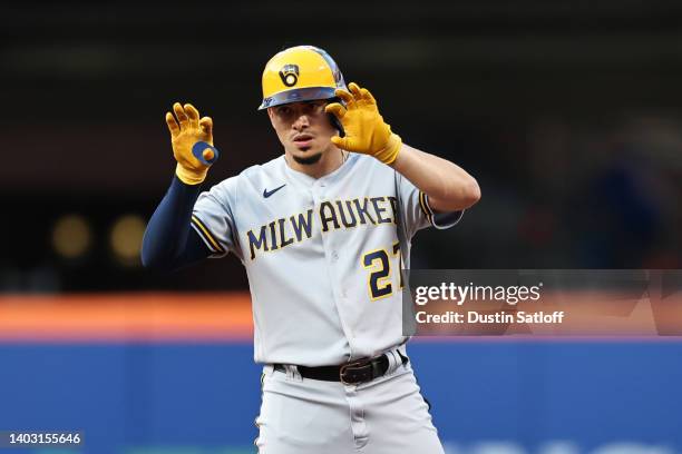 Willy Adames of the Milwaukee Brewers gestures to the dugout after hitting a double during the first inning of the game against the New York Mets at...