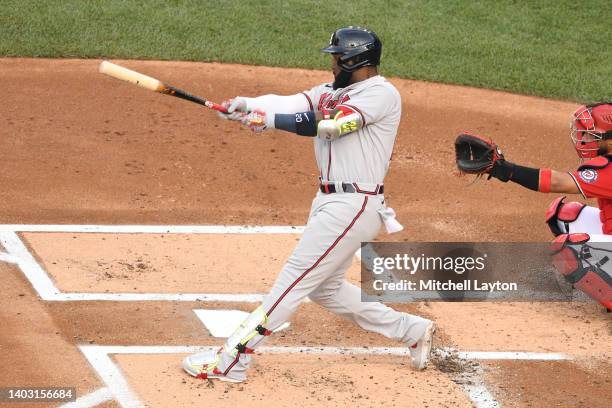 Marcell Ozuna of the Atlanta Braves doubles in the second inning during a baseball game against the Washington Nationals at Nationals Park on June...